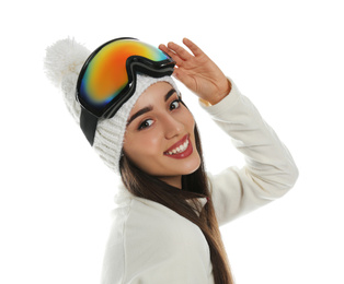 Woman wearing fleece jacket, hat and goggles on white background. Winter sport clothes