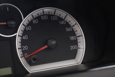 Speedometer on modern car dashboard, closeup view