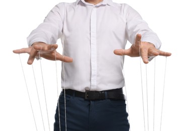 Photo of Man in formal outfit pulling strings of puppet on white background, closeup