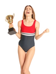 Happy young woman in swimwear holding golden cup on white background