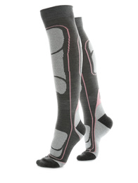 Woman wearing thermal knee socks on white background, closeup of legs. Winter sport clothes