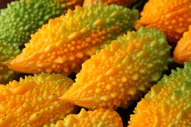 Photo of Tasty fresh bitter melons as background, closeup