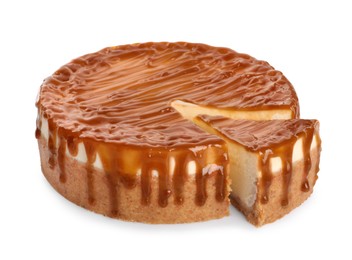 Photo of Sliced delicious cheesecake with caramel isolated on white