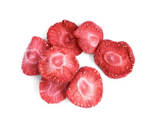 Photo of Pile of freeze dried strawberries on white background, top view