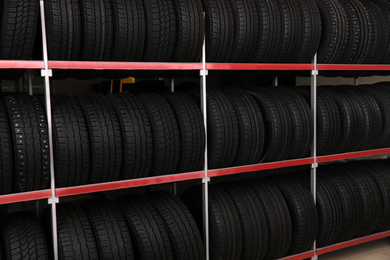 Car tires on rack in auto store