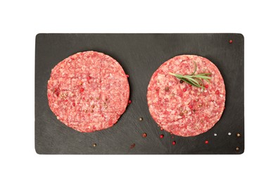 Raw hamburger patties with rosemary and spices on white background, top view
