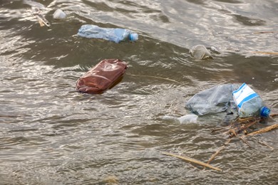 Plastic garbage floating in river. Environment pollution problem