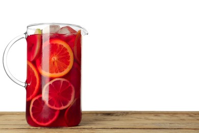 Glass jug of Red Sangria on wooden table against white background. Space for text