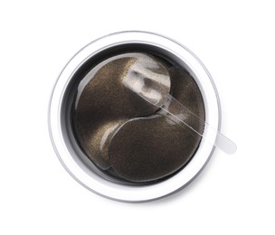 Photo of Under eye patches in jar with spatula isolated on white, top view. Cosmetic product