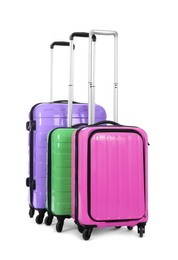 Stylish suitcases packed for travel on white background