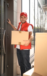 Male mover with parcel box near entrance