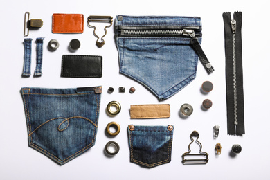 Photo of Composition with garment accessories and cutting details for jeans isolated on white, top view