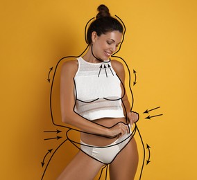 Beautiful slim woman after weight loss on yellow background 
