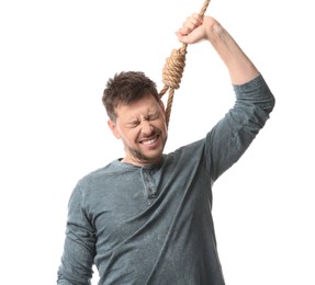 Depressed man with rope noose on neck against white background
