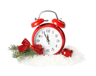 Alarm clock and festive decor in pile of snow on white background. New Year countdown