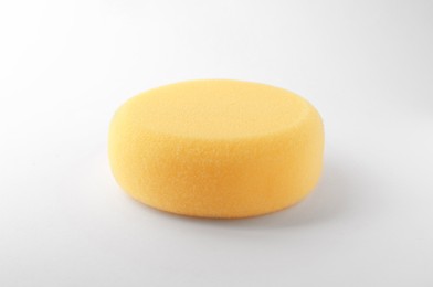 Yellow sponge for clay modeling on white background