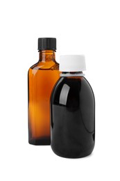 Photo of Bottles of syrups on white background. Cough and cold medicine