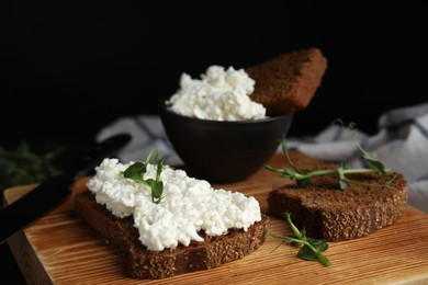 Photo of Bread with cottage cheese and microgreens on wooden board, closeup