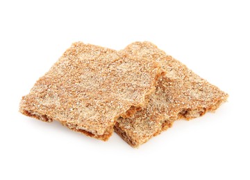 Pieces of crunchy rye crispbread on white background