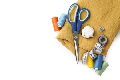 Photo of Set of different sewing accessories on white background, top view