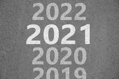 Start new year with fresh vision and ideas. 2021 numbers bigger than others on asphalt road 