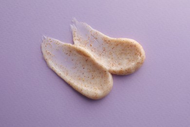 Sample of natural scrub on violet background, top view