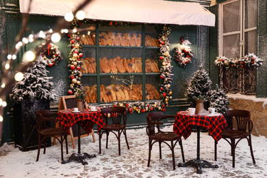 Beautiful outdoor cafe with festive decoration. Christmas celebration