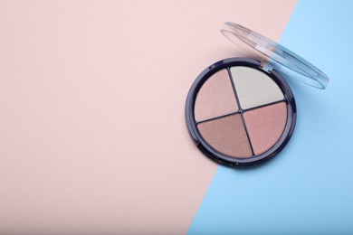 Photo of Contouring palette on color background, top view with space for text. Professional cosmetic product
