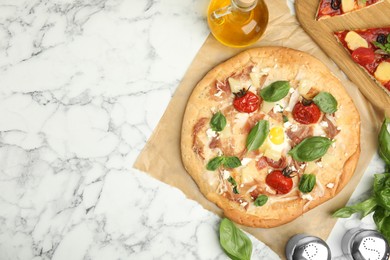 Photo of Delicious homemade pita pizza on white marble table, flat lay. Space for text
