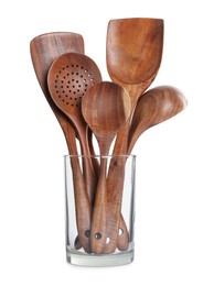 Set of wooden kitchen utensils in glass holder isolated on white