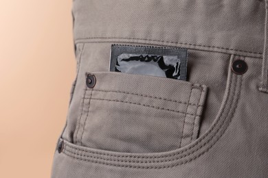 Pants with condom in pocket, closeup. Potency problem