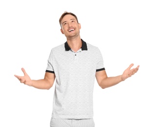 Young man in casual clothes posing on white background