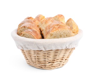 Cut delicious French baguette in wicker basket isolated on white