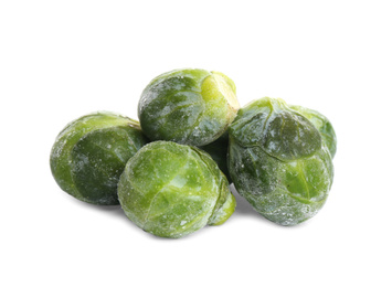 Pile of frozen Brussels sprouts isolated on white. Vegetable preservation