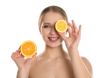 Photo of Young woman with cut orange and lemon on white background. Vitamin rich food