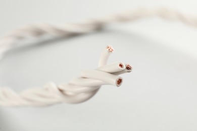 Closeup view of electrical power cables on white background