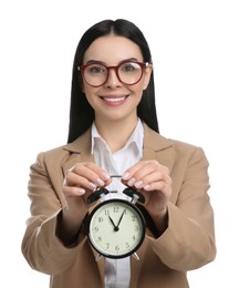 Businesswoman holding alarm clock on white background. Time management