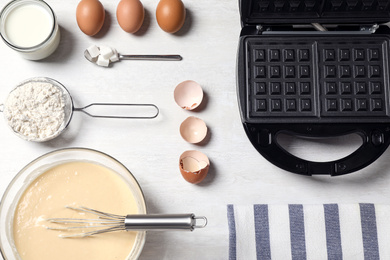 Photo of Flat lay composition with ingredients for cooking Belgian waffles on white table