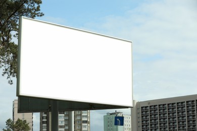Blank advertising board in city. Mockup for design