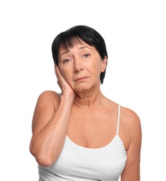 Senior woman suffering from ear pain on white background