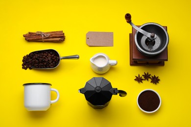 Photo of Flat lay composition with vintage manual grinder and geyser coffee maker on yellow background