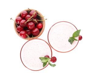 Tasty fresh milk shakes with cherries on white background, top view