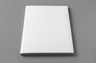 Brochure with blank cover on light grey background