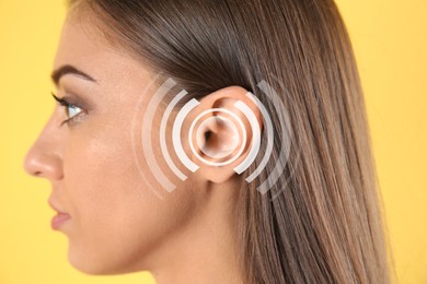 Hearing loss concept. Woman and sound waves illustration on yellow background, closeup