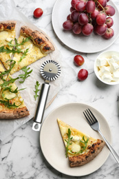 Photo of Tasty cheese pizza served on white marble table, flat lay