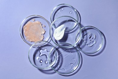 Photo of Flat lay composition with Petri dishes on lilac background