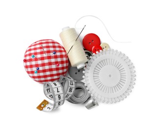 Spool of thread and sewing tools on white background, top view