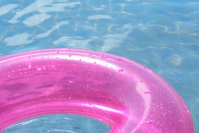Bright inflatable ring floating on sea water, closeup