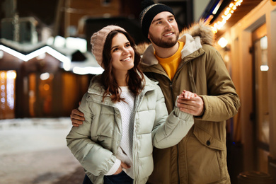 Lovely couple on city street. Winter vacation