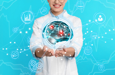Image of Doctor demonstrating digital image of human brain on blue background, closeup. Machine learning concept